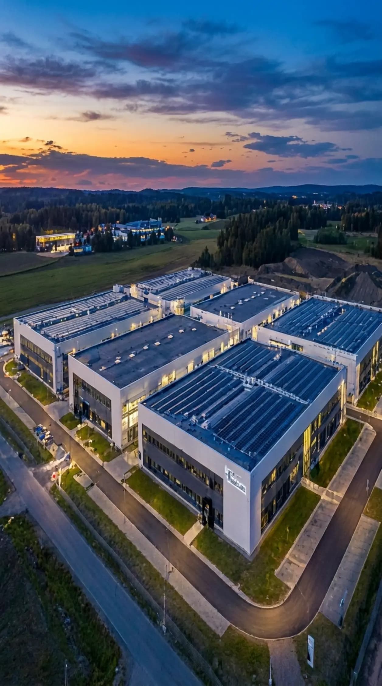 Aerial view of a manufacturing campus at dusk